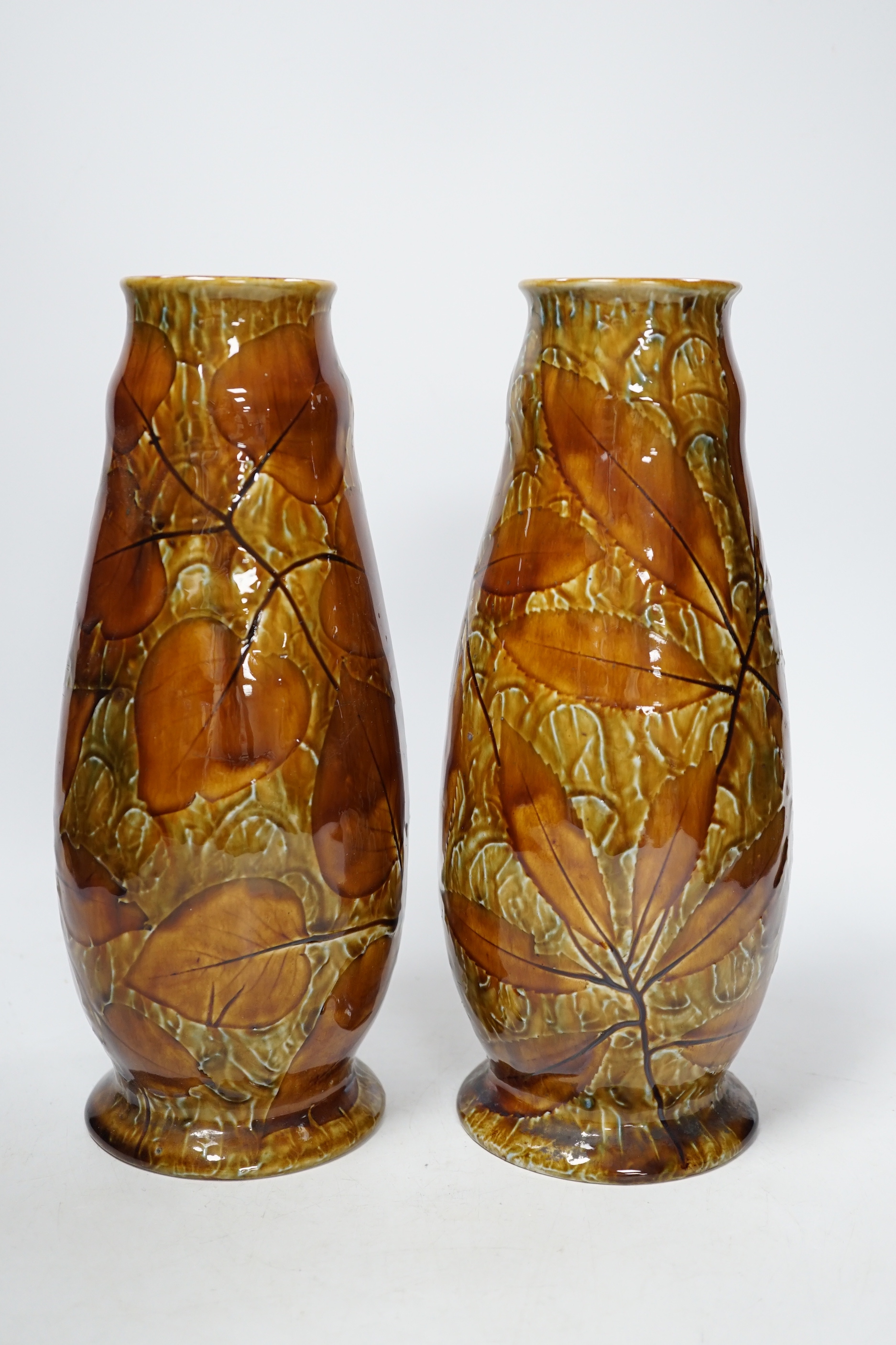 A pair of Doulton Natural Foliage ware vases, 27cm